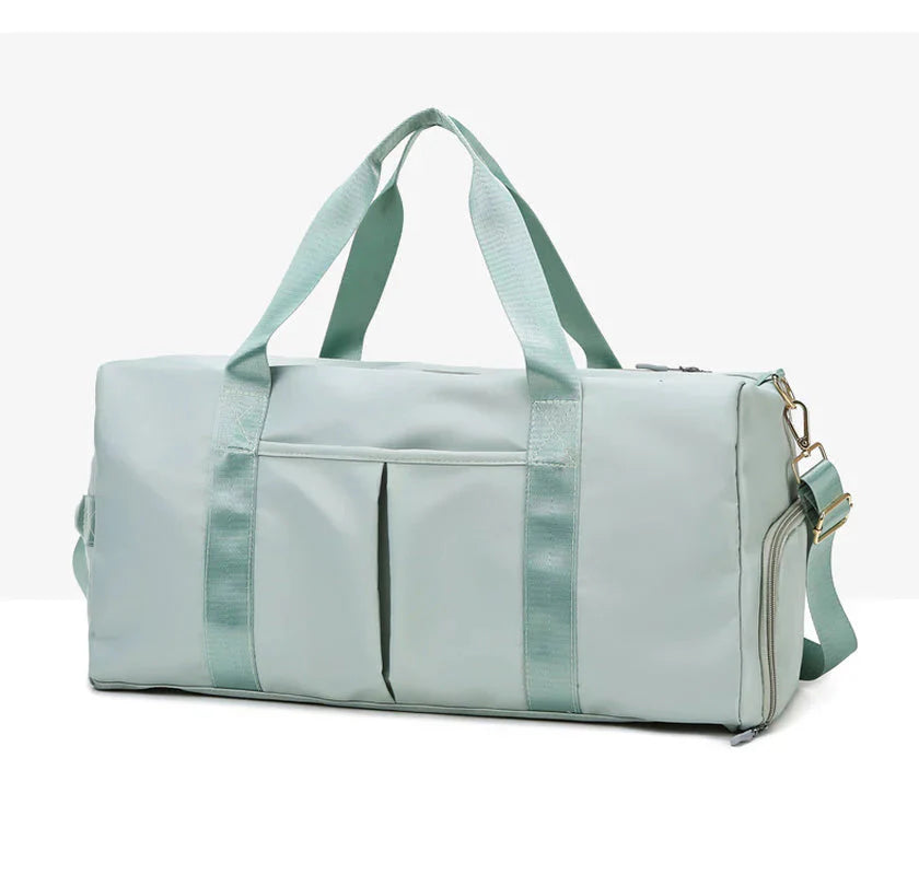 MotionMade waterproof fitness duffel bag in teal – versatile gym weekender for men and women