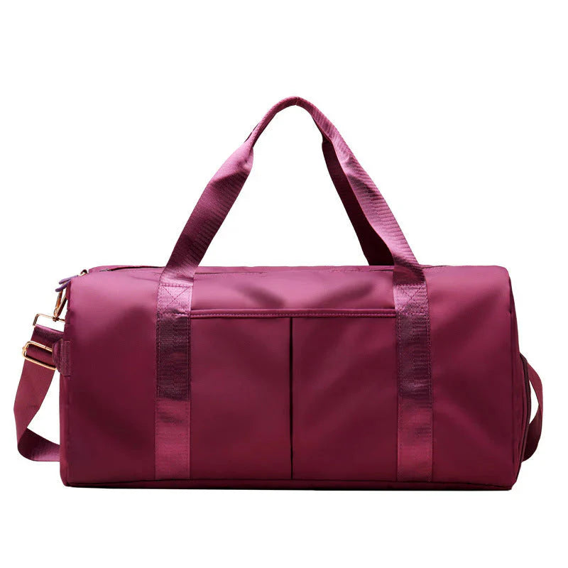 MotionMade waterproof fitness duffel bag in maroon – versatile gym weekender for men and women
