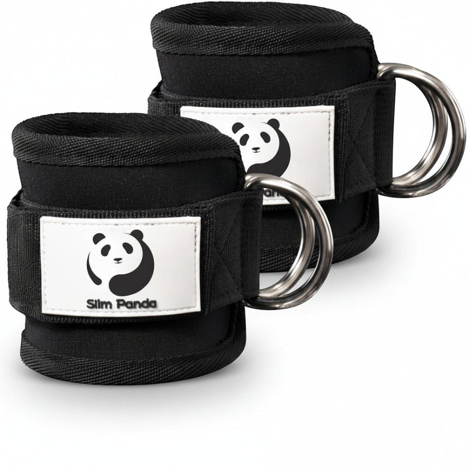 MotionMade pair of black neoprene ankle straps with heavy-duty D-rings for cable machine glute and leg workouts.