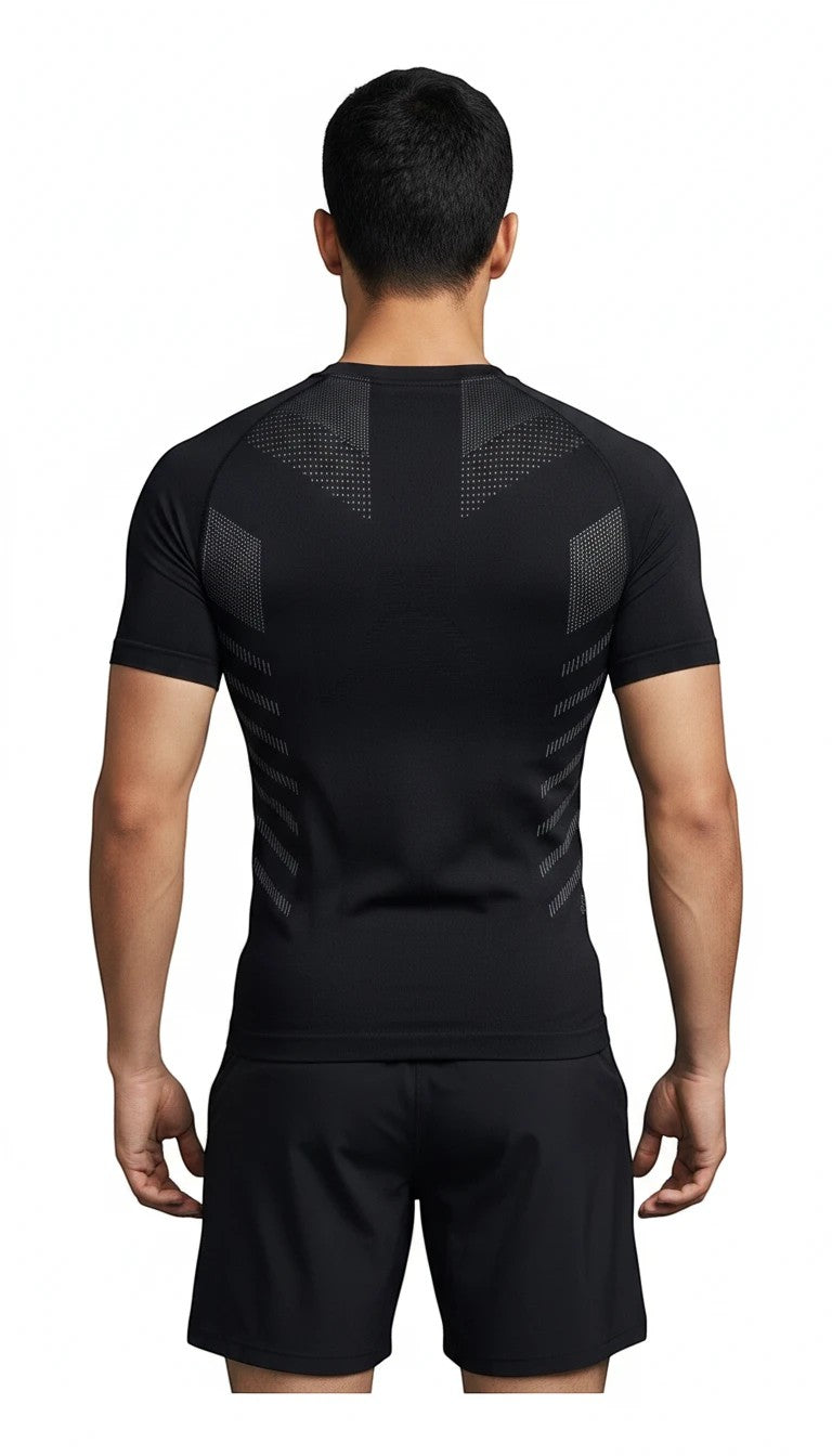Back view of a man wearing a black MotionMade seamless knitted compression shirt with athletic body-mapping details.